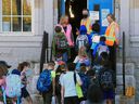 Students at Stanley Jones School enter class on Tuesday, September 1, 2020. It was the first day for students at the Calgary Board of Education resuming amid the COVID-19 pandemic. 